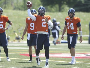 James Franklin (2) gets in some reps as fellow Argos QBs Dakota Prukop (9) and McLeod Bethel-Thompson (14) look on.  JACK BOLAND/TORONTO SUN