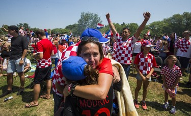 Croatian fan Julie Despot embraces following her team's loss to France after watcing the World Cup Final on the big screen at Croatian Parish Park in Mississauga, Ont. on Sunday July 15, 2018. Ernest Doroszuk/Toronto Sun/Postmedia