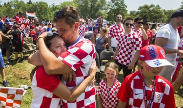 Croatian fan Mijo Despot kisses his wife Julie, following Croatia's loss to France after watcing the World Cup Final on the big screen at Croatian Parish Park in Mississauga, Ont. on Sunday July 15, 2018. Ernest Doroszuk/Toronto Sun/Postmedia