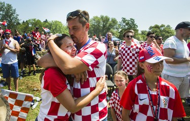 Croatian fan Mijo Despot kisses his wife Julie, following Croatia's loss to France after watcing the World Cup Final on the big screen at Croatian Parish Park in Mississauga, Ont. on Sunday July 15, 2018. Ernest Doroszuk/Toronto Sun/Postmedia