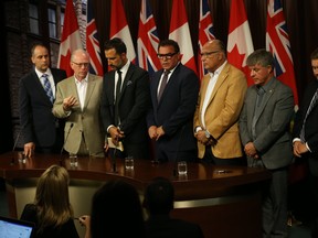 A group of city councillors showed up at the Ontario Legislature supporting the downsizing of Toronto city council on Monday.  (Jack Boland/Toronto Sun)