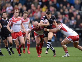 The Toronto Wolfpack 
(Nick Rawsthorne pictured centre) has had plenty of success on both sides of the Atlantic. Now team captain Josh McCrone (inset) returns to helm the team. (Getty images)