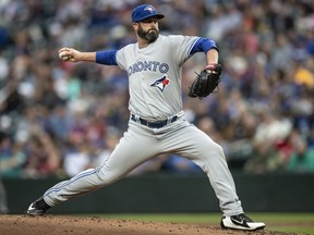 Reliever Mike Hauschild #44 of the Toronto Blue Jays delivers a pitch during the second inning of a game against the Seattle Mariners at Safeco Field on August 2, 2018 in Seattle, Washington.