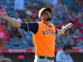 Roberto Osuna #54 of the Houston Astros reacts after earning a save by striking out Shohei Ohtani #17 of the Los Angeles Angels of Anaheim for the final out of the game in the ninth inning at Angel Stadium on August 26, 2018 in Anaheim, California. (Jayne Kamin-Oncea/Getty Images)