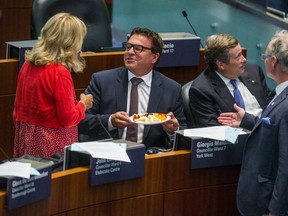 At this week's city council meeting where the plan to downsize council was discussed, Councillor Giorgio Mammoliti offered cheese to go with the "whine" from municipal councillors. (Ernest Doroszuk, Toronto Sun)