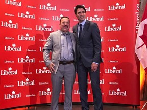 Amin El-Maoued, left, poses with Canadian Prime Minister Justin Trudeau at the Laurier Club Summer Reception and Garden Party (Facebook photo)