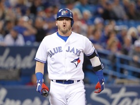 Josh Donaldson #20 of the Toronto Blue Jays reacts after fouling a ball off his leg in the first inning during MLB game action against the Boston Red Sox at Rogers Centre on May 12, 2018 in Toronto, Canada.