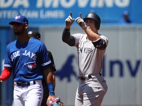 In this July 8 file photo, New York Yankees outfielder Giancarlo Stanton celebrates a double against the Toronto Blue Jays.