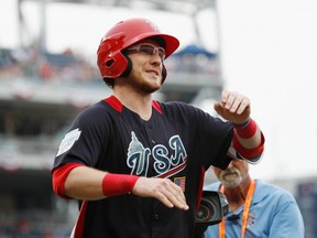 Danny Jansen #9 of the Toronto Blue Jays and the U.S. Team celebrates after hitting a two-run home run and scoring in the fourth inning against the World Team during the SiriusXM All-Star Futures Game at Nationals Park on July 15, 2018 in Washington, DC.  (Photo by Patrick McDermott/Getty Images)