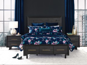 A moody blue blackground makes florals crisp and fresh. (Urban Barn.)