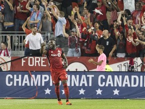Toronto FC's Jozy Altidore celebrates after teammate Sebastian Giovinco (not shown) scores his team's second goal during first-half action against the Vancouver Whitecaps in the Canadian Championship second leg in Toronto on Wednesday, Aug. 15, 2018. (CHRIS YOUNG/THE CANADIAN PRESS)