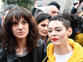 Italian actress Asia Argento (L) and U.S. singer and actress Rose McGowan take part in a march organized by 'Non Una Di Meno' (Me too) movement on March 8, 2018 as part of the International Women's Day in Rome. (Photo by / AFP) (Photo credit should read ALBERTO PIZZOLI/AFP/Getty Images)