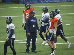 Toronto Argonauts QB coach Anthony Calvillo with Mario Alford (13)  in preparation for their Thursday pre-season game were at practice in Vaughan, Ont. Jack Boland/Toronto Sun/Postmedia Network
