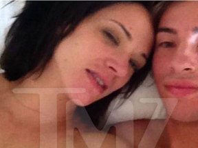 Whoops! TMZ obtained a photo of Asia Argento and the boy she paid off after he accused her of rape. She is topless. TMZ