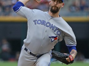 After being traded from the Blue Jays, pitcher John Axford is getting a chance to help the Los Angeles Dodgersreturn to the World Series for a second consecutive year. (Jonathan Daniel/Getty Images)