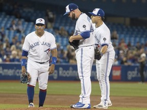 Toronto Blue Jays starting pitcher Mike Hauschild waits with teammates for manager John Gibbons to take him out of the game in the third inning of their American League MLB baseball game against the Boston Red Sox, in Toronto on Wednesday, August 8, 2018. THE CANADIAN PRESS/Fred Thornhill