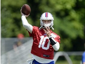 Buffalo Bills quarterback A.J. McCarron throws a pass during practice at the NFL football team's training camp in Pittsford, N.Y., Friday, July 27, 2018.
