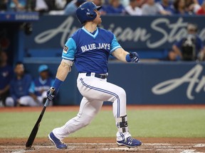 Blue Jays batter Billy McKinney hits a two-run home run in the third inning against the Phillies during MLB action in Toronto on Friday, Aug. 24, 2018.