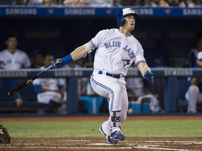 Blue Jays left fielder Billy McKinney (28) hits a two run RBI single against the Orioles during forth inning MLB action in Toronto on Tuesday, Aug. 21, 2018.