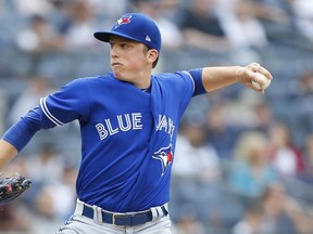Toronto Blue Jays starting pitcher Ryan Borucki (56) pitches in the first inning of a baseball game against New York Yankees, Sunday, Aug. 19, 2018 in New York. (AP Photo/Noah K. Murray)