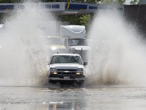 Heavy rainfall during the afternoon on August 8, 2018 resulted in several roadways becoming flooded in Brantford, Ont, including here on Edmondson Street. Storm drains became overwhelmed, particularly bridge underpasses on Market Street and St. Paul Avenue where vehicles had stalled in the deep water. (Brian Thompson/Brantford Expositor/Postmedia Network)