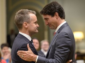 Prime Minister Justin Trudeau congratulates new veterans Affairs Minister Seamus O'Regan at a swearing-in ceremony at Rideau Hall in Ottawa on Monday, Aug. 28, 2017.