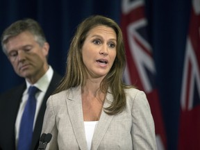 Ontario Attorney General Caroline Mulroney and Ontario Minister of the Environment Rod Phillips at a press conference at Queen's Park in Toronto, Ont. on Thursday August 2, 2018. (Stan Behal/Toronto Sun/Postmedia Network)