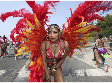 The 51st annual Toronto Caribbean Carnival took to the CNE grounds and Lakeshore Blvd. for the massive parade attended by tens of thousands of partners, masqueraders, revellers and has and pan bands on Saturday August 4, 2018. Jack Boland/Toronto Sun/Postmedia Network