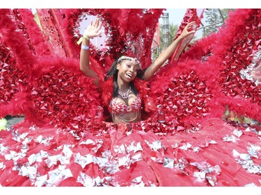 Taneisha Edwards, of Tribal Carnival was wearing her massive Red Queen outfit. The 51st annual Toronto Caribbean Carnival took to the CNE grounds and Lakeshore Blvd. for the massive parade attended by tens of thousands of partners, masqueraders, revellers and has and pan bands on Saturday August 4, 2018. Jack Boland/Toronto Sun/Postmedia Network
