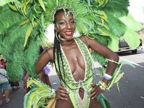 Lisa Phillips , dressed in her Playing in Paradise costume for Carnival Nation as been coming to the carnival since she was a kid and will be 30 later this year. She was part of the The 51st annual Toronto Caribbean Carnival took to the CNE grounds and Lakeshore Blvd.  on Saturday August 4, 2018. Jack Boland/Toronto Sun/Postmedia Network
