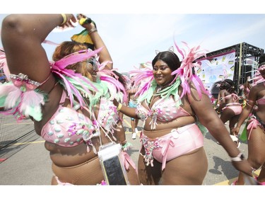 The 51st annual Toronto Caribbean Carnival took to the CNE grounds and Lakeshore Blvd. for the massive parade attended by tens of thousands of partners, masqueraders, revellers and has and pan bands on Saturday August 4, 2018. Jack Boland/Toronto Sun/Postmedia Network