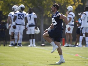 Los Angeles Chargers defensive end Joey Bosa warms up during NFL football practice, Saturday, July 28, 2018, in Costa Mesa, Calif.