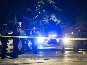 Chicago cops respond to a hooting. There were 72 of them from Friday night to early Monday. Victims were aged from 11 to 62.