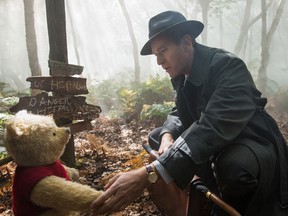 Christopher Robin (Ewan McGregor) and Winnie the Pooh in a scene from Disney's Christopher Robin.