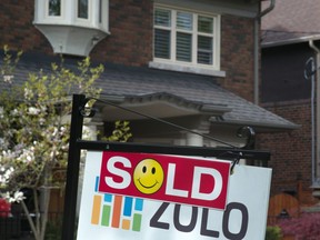 The Toronto Real Estate Board is studying ways to ensure Greater Toronto Area home sales data is "protected," even as realtors are rushing to publish the numbers in the wake of a precedent-setting court case. A sold sign is shown in front of west-end Toronto homes Sunday, May 14, 2017. THE CANADIAN PRESS/Graeme Roy
