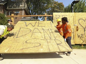 The Danforth shooting memorial is removed from Logan Field Green Parkette on Thursday, Aug. 23, 2018. (Jack Boland/Toronto Sun)