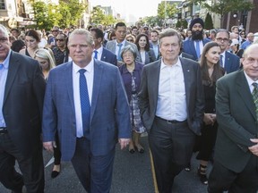 Ontario Premier Doug Ford and Toronto Mayor John Tory during a vigil along the Danforth in Toronto, Ont. on Wednesday July 25, 2018. Ernest Doroszuk/Toronto Sun