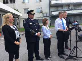 Fire Chief Matthew Pegg listens as Mayor John Tory speaks about the Parliament St. apartment building fire on Thursday, Aug. 23, 2018. (John Tory/Twitter)