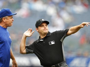 First base umpire Jansen Visconti throws Toronto Blue Jays manager John Gibbons out of the game against the New York Yankees in the sixth inning in New York, on Sunday. (AP)