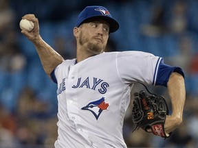 Toronto Blue Jays pitcher Ken Giles throws in the 10th inning of his team's game against the Boston Red Sox, in Toronto on  Aug. 7, 2018.  (FRED THORNHILL/The Canadian Press)