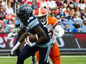 Argonauts wide receiver S.J. Green (front) runs the ball in the first quarter against the BC Lions on Saturday at BMO Field. (Christopher Katsarov/The Canadian Press)