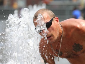 Yonge Dundas Square was a great place to beat the heat in downtown Toronto when the temperature soared to between 34C and 45C earlier this summer. (Jack Boland/Toronto Sun/Postmedia Network)