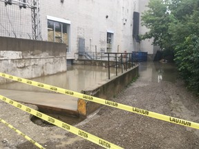 Water levels at 501 Alliance Ave. rising where two men narrowly escaped drowning in a flooded elevator Tuesday night.