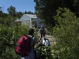 At the end of Roxham Rd. in Champlain, Fiyori Mesfin, 32, crosses into Canada with her three-year-old son and one-year-old daughter, both U.S. citizens.