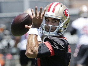 In this June 13, 2018, file photo, San Francisco 49ers quarterback Jimmy Garoppolo throws a pass during practice at the team's headquarters in Santa Clara, Calif. (AP Photo/Jeff Chiu, File)