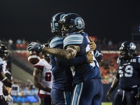 The Argonauts celebrate after Thursday's improbable comeback win over Ottawa at BMO Field. THE CANADIAN PRESS