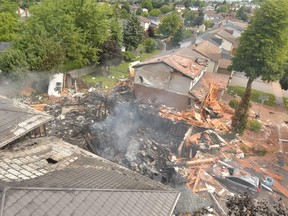 Debris is shown following a house explosion in Kitchener, Ont., on Wednesday, Aug. 22, 2018. THE CANADIAN PRESS/HO - Kitchener Fire Department