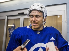 The Maple Leafs' Par Lindholm talks to the media following a summer skate at the MasterCard Centre on Monday. (Ernest Doroszuk/Toronto Sun)