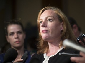 Lisa Macleod, Ontario's Children, Community and Social Services Minister, talks with the media after Question Period at the Ontario Legislature in Toronto on Thursday, August 2, 2018. (THE CANADIAN PRESS/Chris Young)