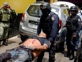 A mechanic is shot in Acapulco. July shattered a record for homicides in Mexico.